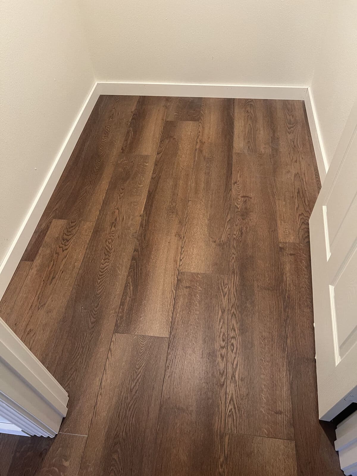 Dark oak vinyl plank installed by 254 Floors