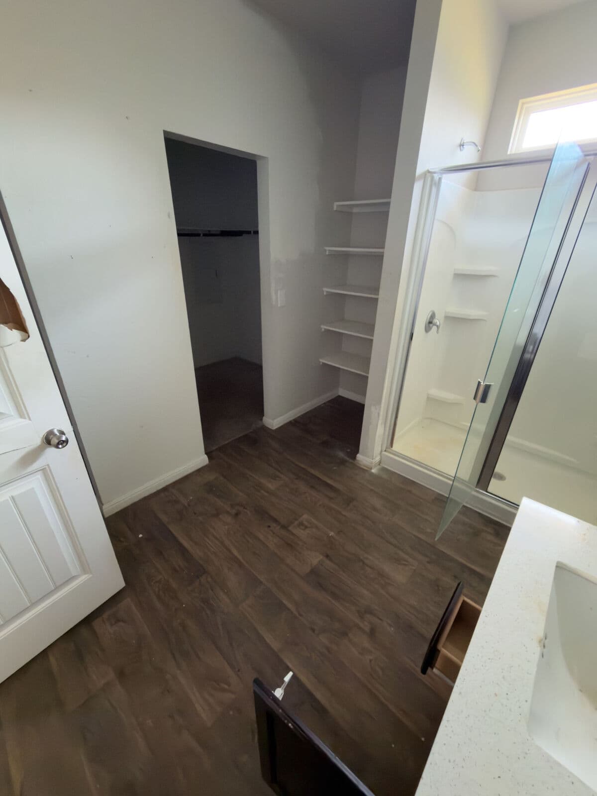 Brown oak vinyl plank after tile removal