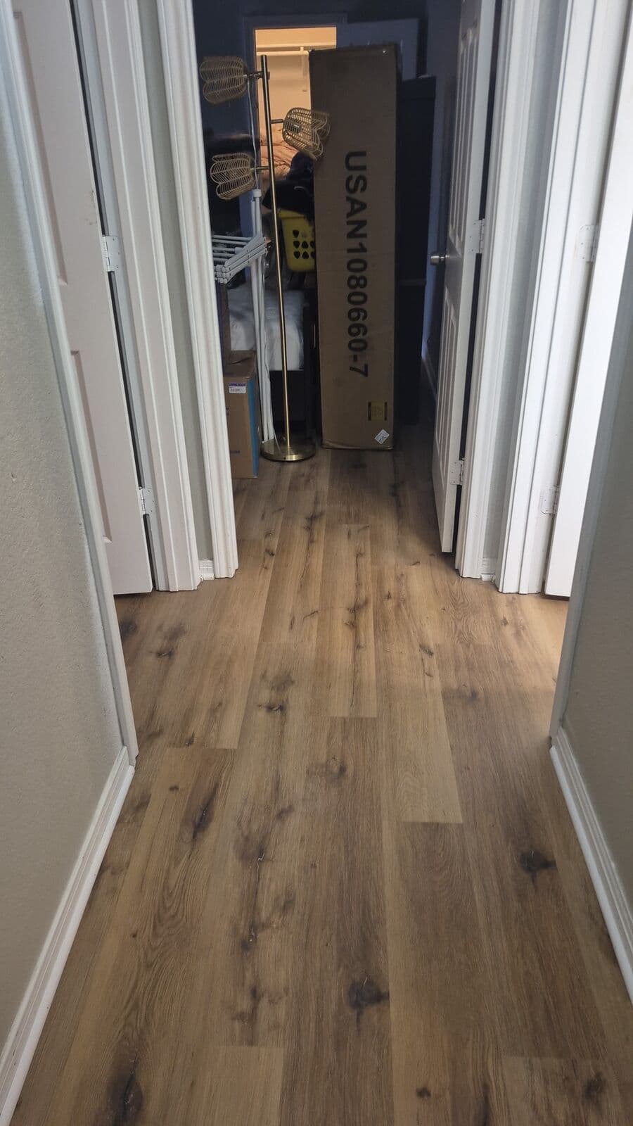 Brown oak vinyl plank after tile removal
