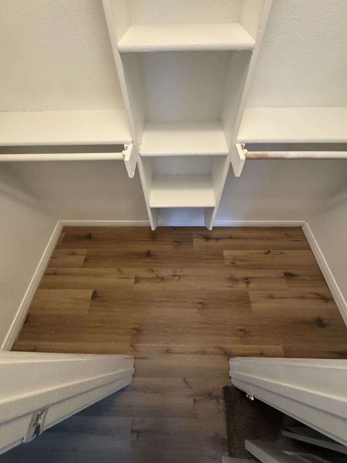 Brown oak vinyl plank after tile removal