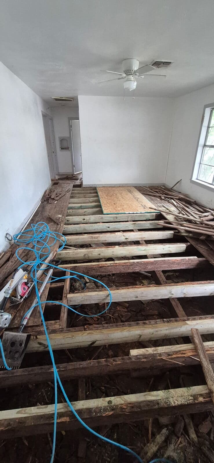 Before: rotted joists under the old floor, Mart, TX