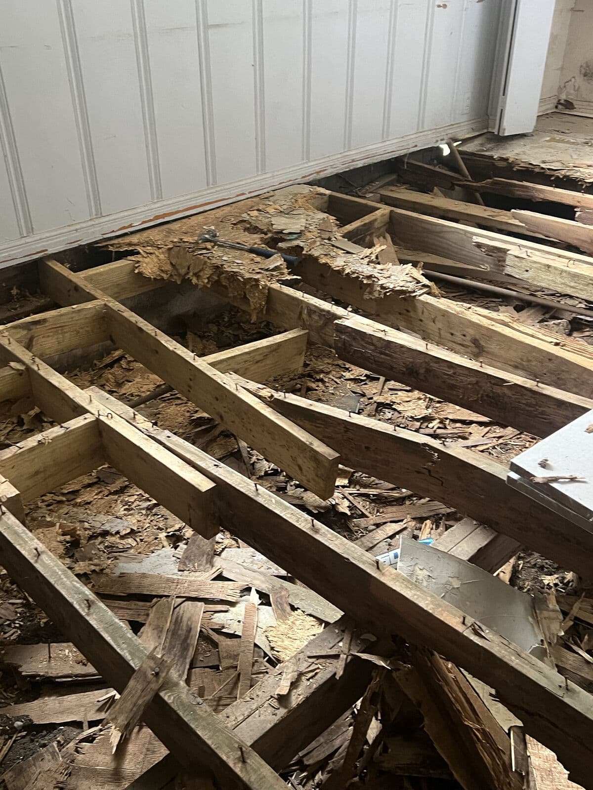 Before: rotted joists under the old floor, Mart, TX