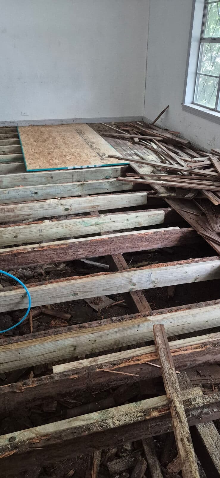 Before: rotted joists under the old floor, Mart, TX