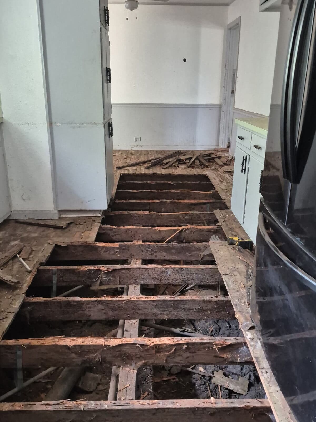 Before: rotted joists under the old floor, Mart, TX