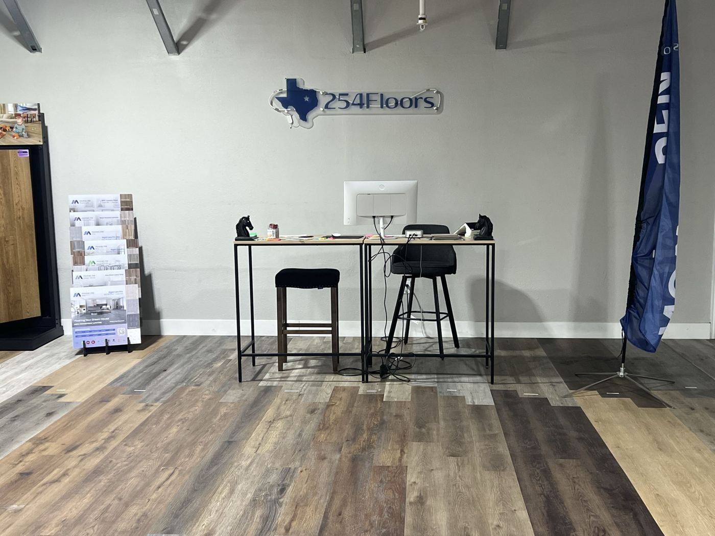 Front desk and 254 Floors sign inside the Waco showroom
